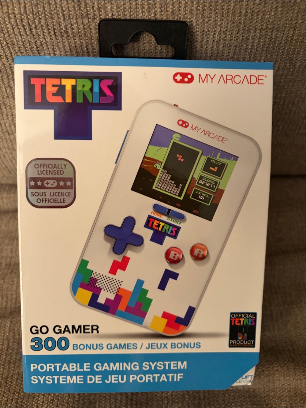 Arcade White Tetris Portable Gaming System with Colorful Tetris Accents